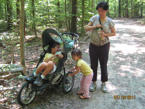 Photo Editor_110718bg Karis pushing the stroller with Josiah on at Burke Lake.JPG